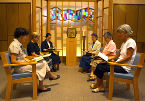 Sisters at prayer in the chapel sanctuary